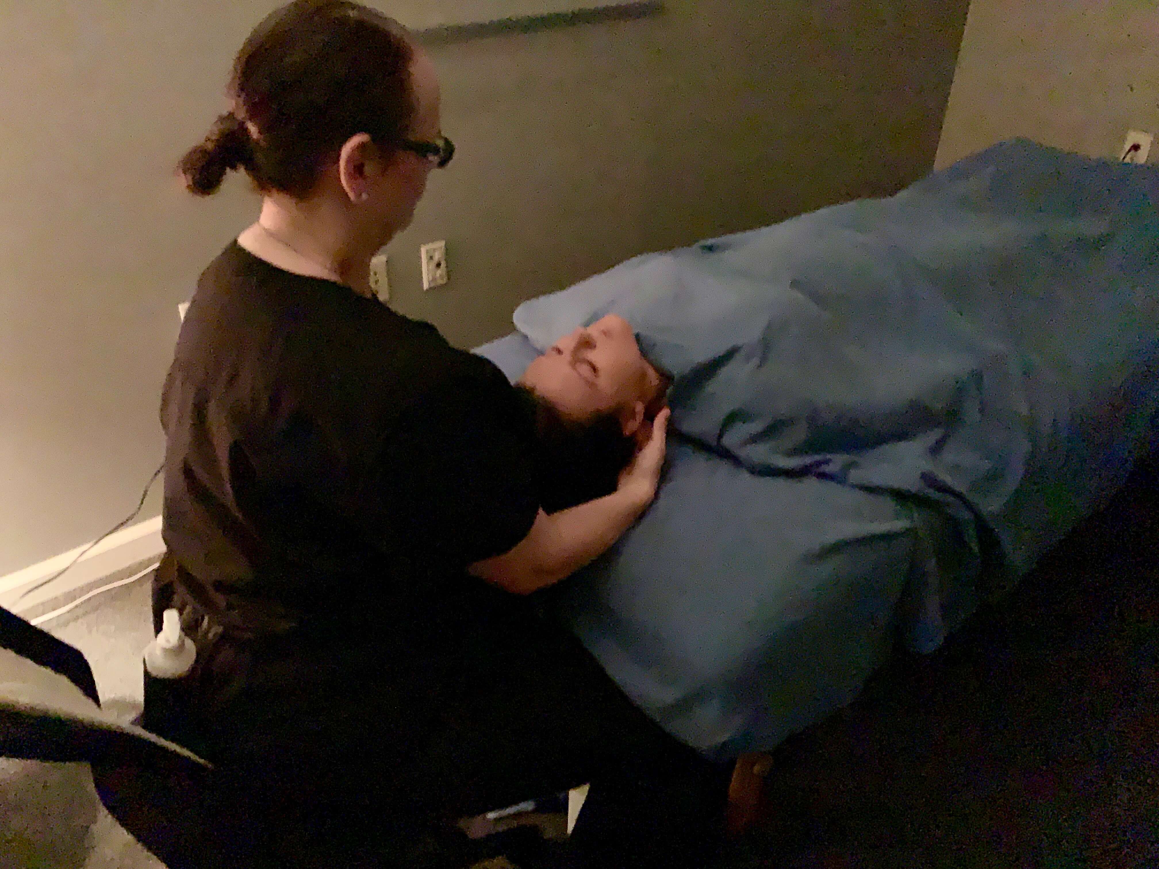 amy massages a client at foundation chiropractic in hampton georgia